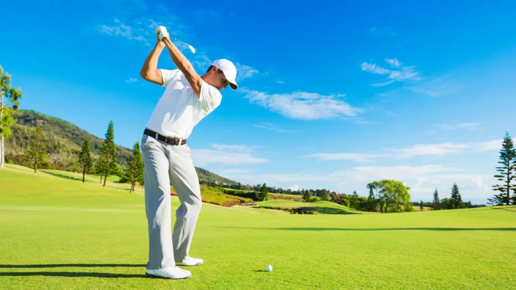 A man playing gulf in wite t-shirt in a sunny day