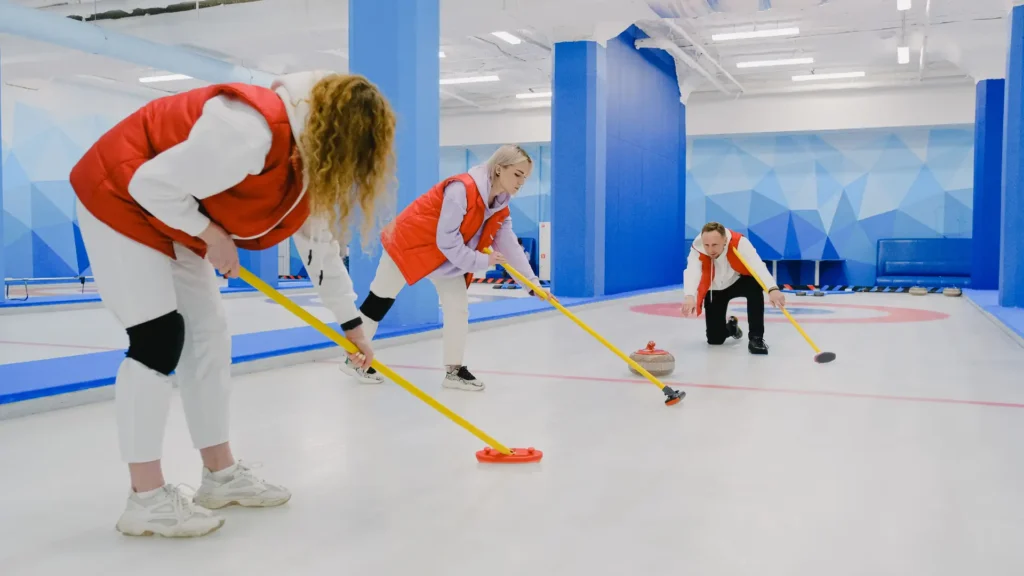 girls playing curling