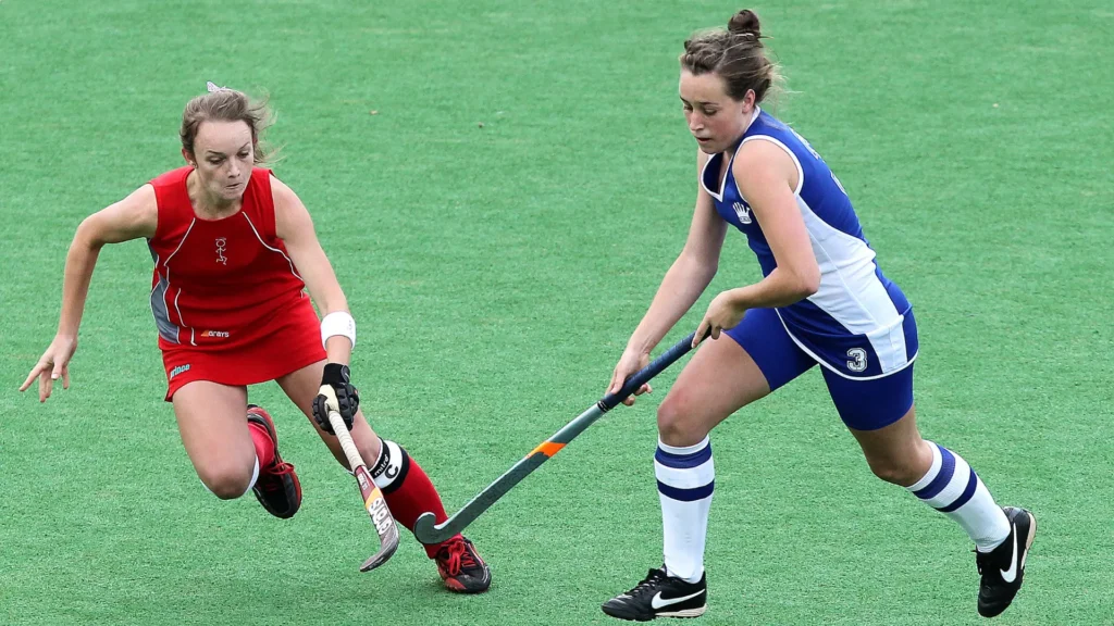 women playing hockey