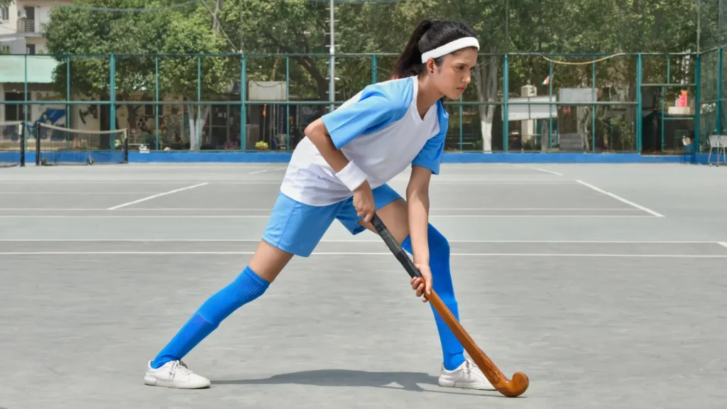 a women playing hockey