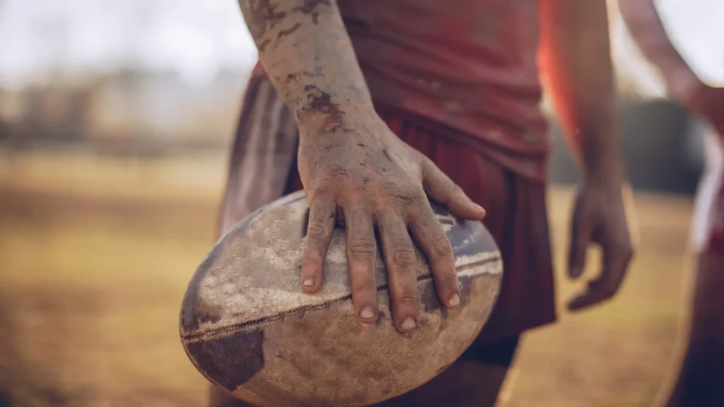 muddy rugby ball